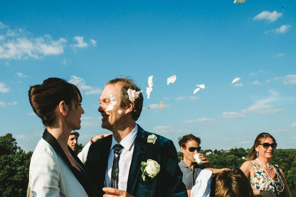 Flower petal in the air maried couple kiss