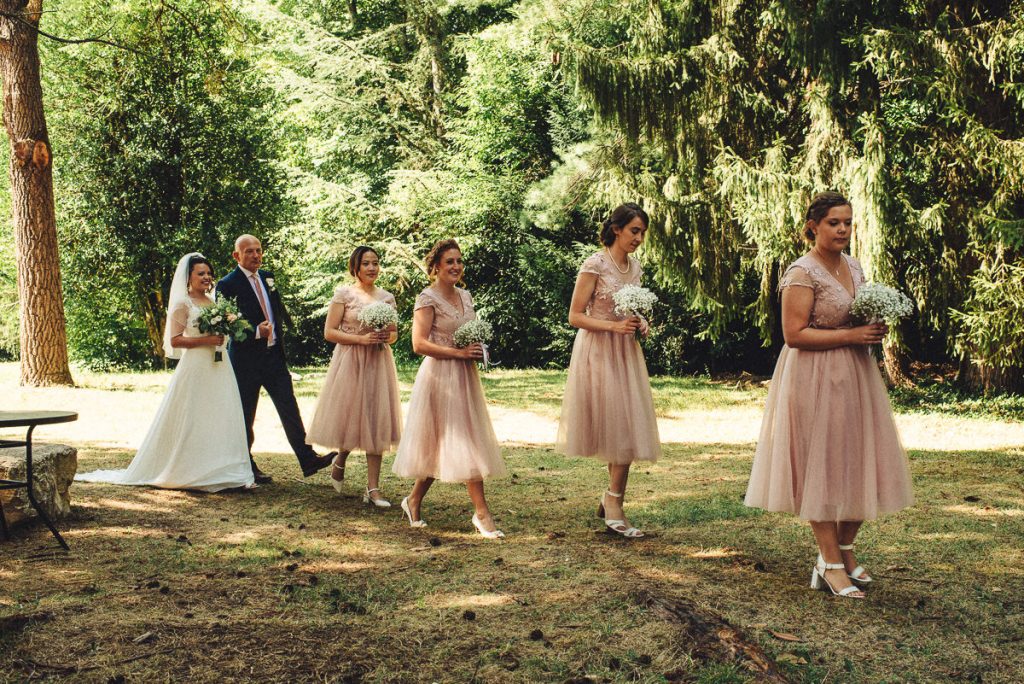 bride and bridemaids walking to ceremony at Chateau Saint Michel South of France